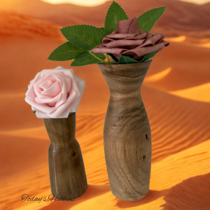 Handcrafted woodworking vase decor featuring two wooden vases with textured grains holding delicate rose flowers