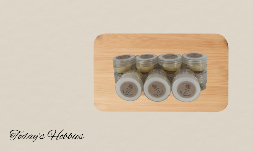 Set of handcrafted lotion bars in small jars on a wooden tray for natural skin hydration