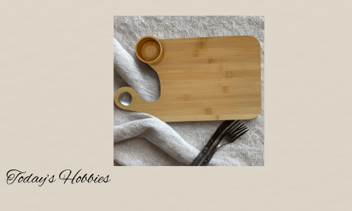 Today's Hobbies bamboo charcuterie board with salsa cup and wooden texture on fabric background