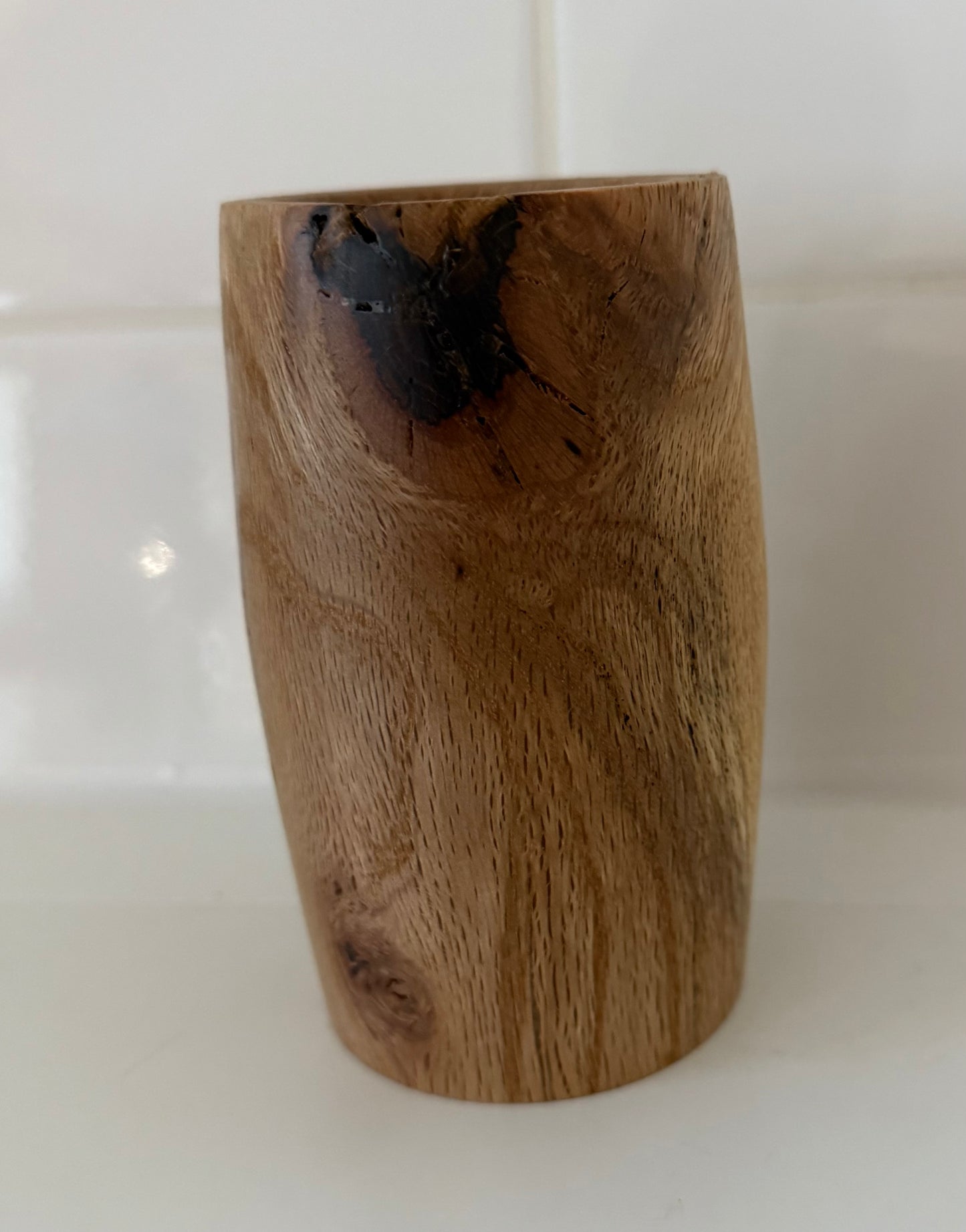 Handcrafted wood piece with natural grain and dark knot, perfect handcrafted gift for home office decor