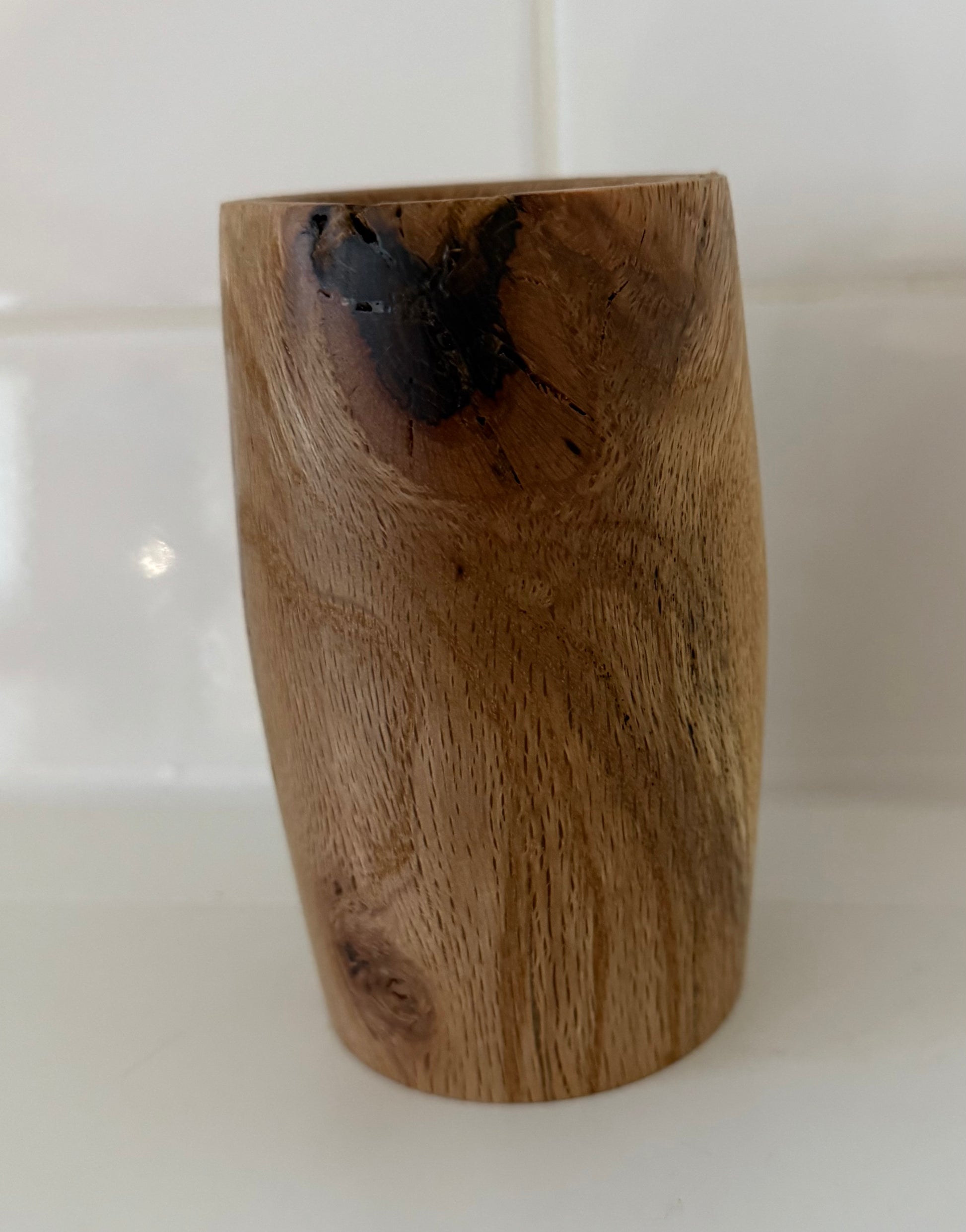 Handcrafted wood piece with natural grain and dark knot, perfect handcrafted gift for home office decor