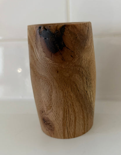 Handcrafted wood piece with natural grain and dark knot, perfect handcrafted gift for home office decor