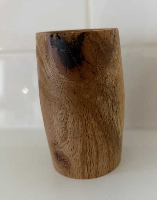 Handcrafted wood piece with natural grain and dark knot, perfect handcrafted gift for home office decor