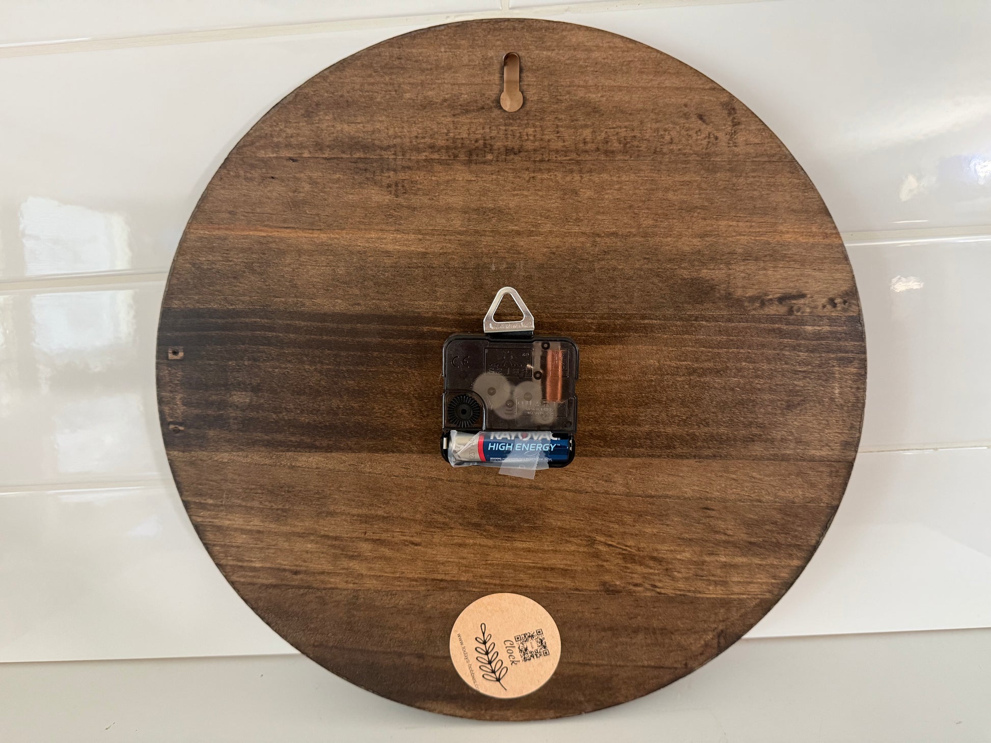 Back view of a wooden handcrafted wall clock for home decor by Today’s Hobbies showing the clock mechanism