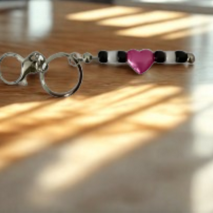 Today's Hobbies handmade beaded keychain with black and white beads and a pink heart centerpiece
