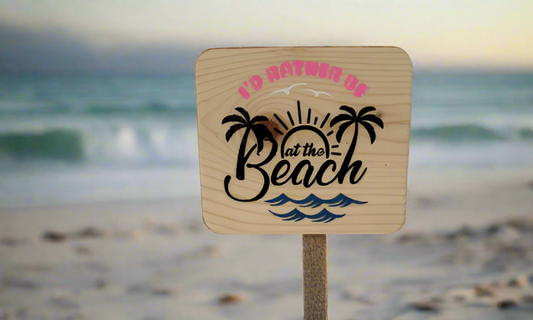 Wooden sign with beach design and text standing on sandy shore, Today’s Hobbies handmade pumpkin wall decor