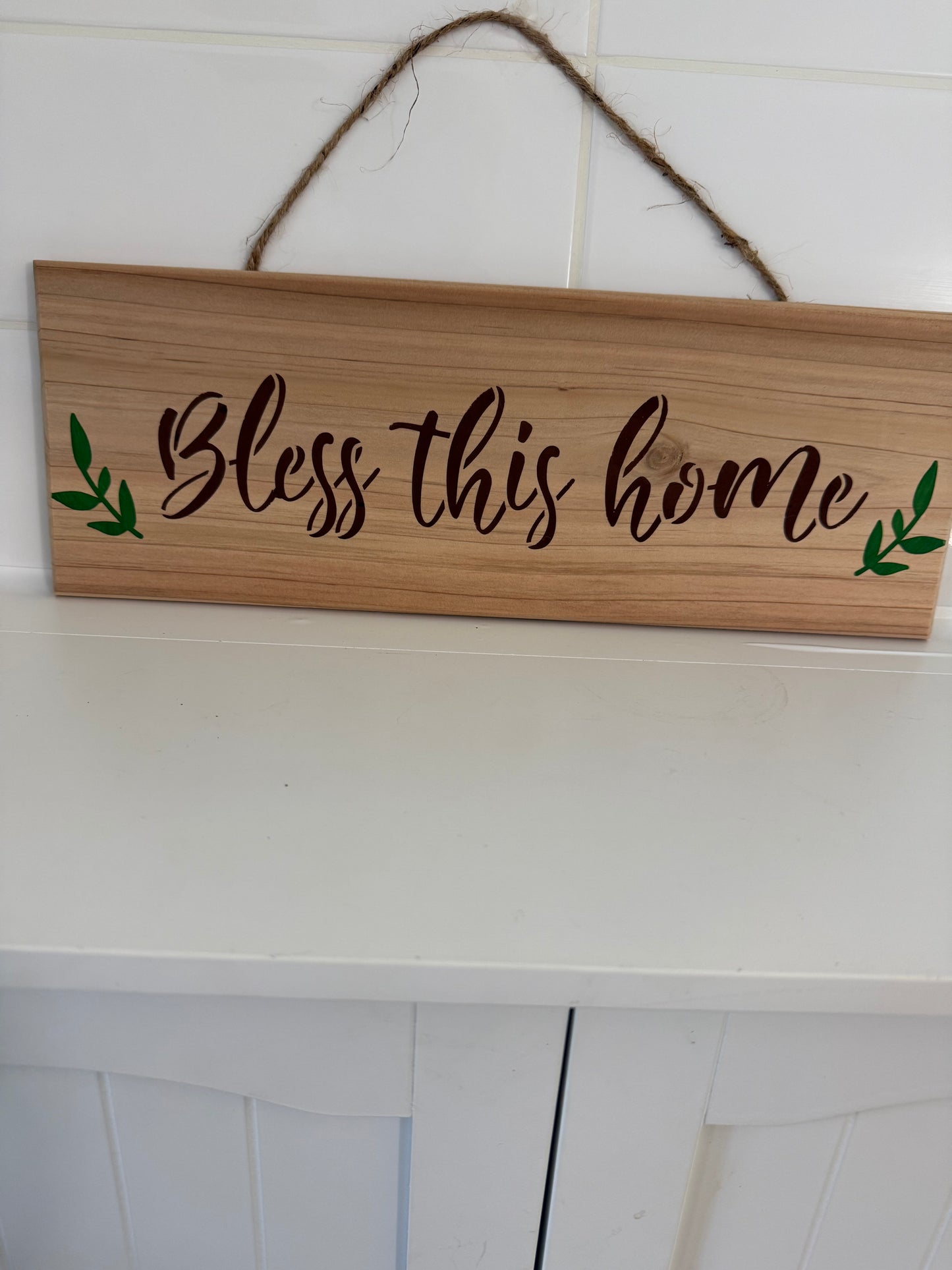 Wooden wall sign with Bless this home text and green leaf accents rustic coffee kitchen wall decor