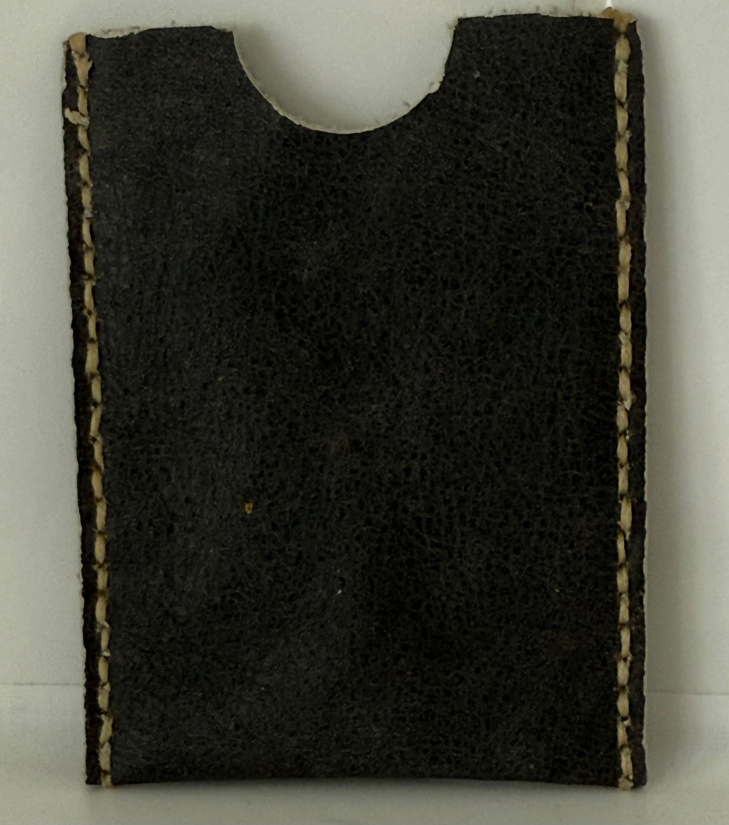 Slim leather card sleeve made of 100 percent cow hide with hand-stitched edges
