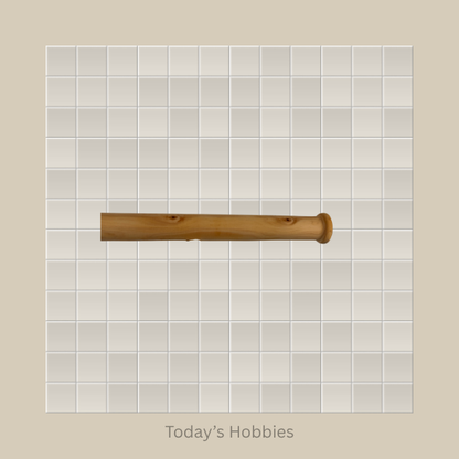 Handcrafted wooden baton in natural wood finish displayed on a tiled background by Todays Hobbies