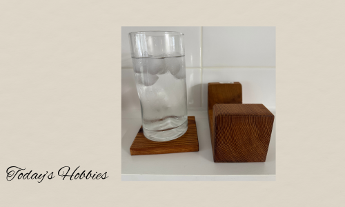 Today’s Hobbies red cedar coaster set of 6 with clear glass of water on one coaster