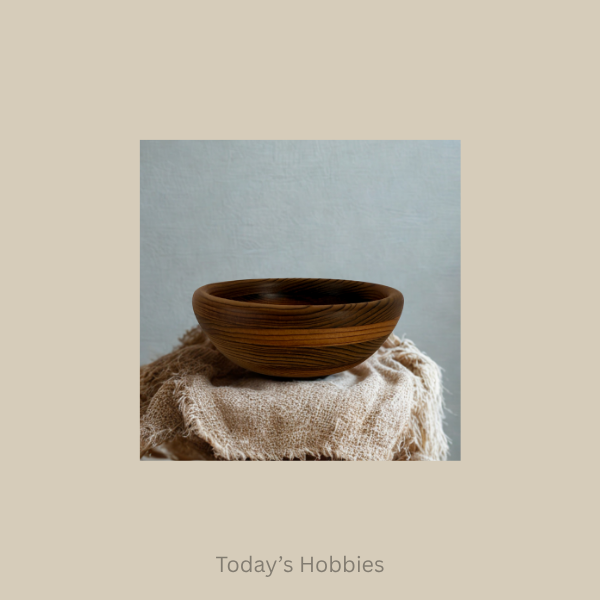 Red cedar home decor bowl made of wood with natural grain placed on textured fabric