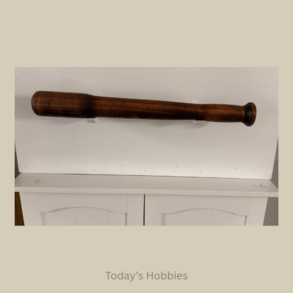 Wooden baseball bat from Todays Hobbies as unique home decor accents in a dark finish