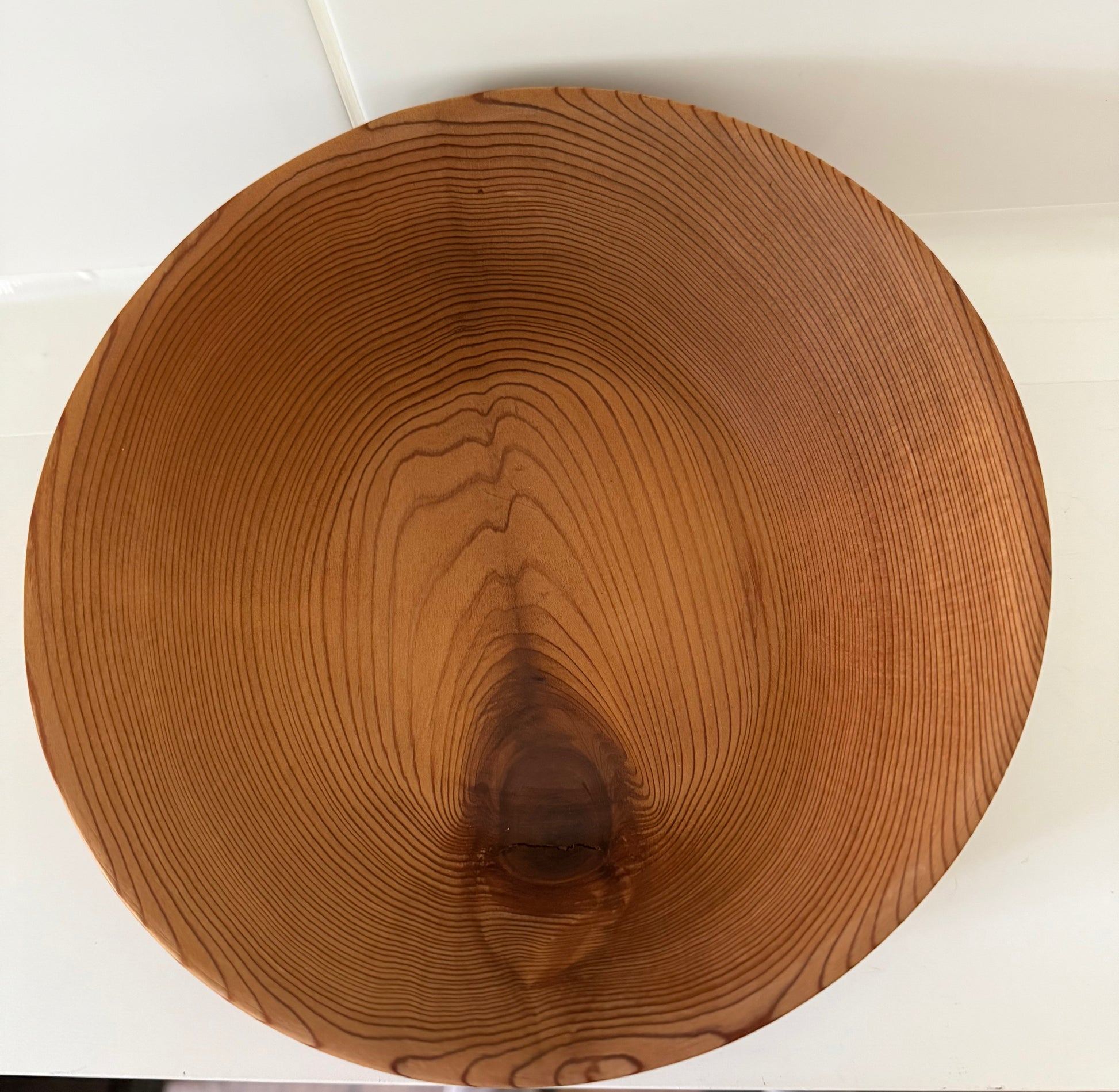 Round wooden bowl made from western red cedar home decor with natural wood grain pattern