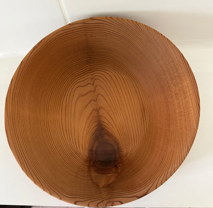 Round wooden bowl made from western red cedar home decor with natural wood grain pattern