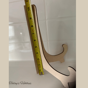 Wooden handmade home decor stand from Today’s Hobbies measured with a yellow tape measure